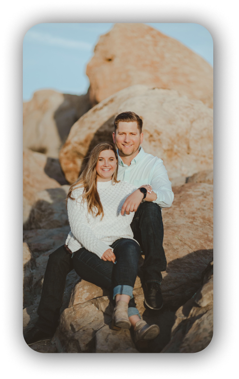 picture of taylor and josie posing on top of some rocks for a cute photo